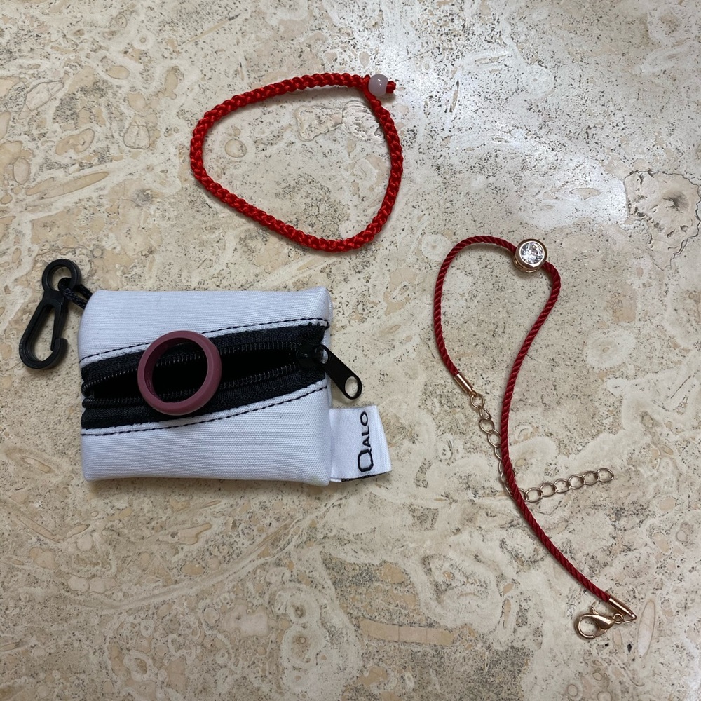 Qalo ring and red string bracelet